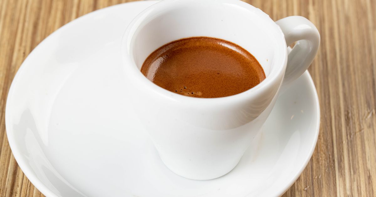 A cup of espresso on a white saucer